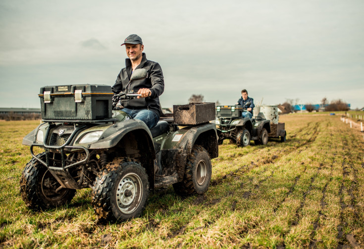 Boer op een Landbouw quad